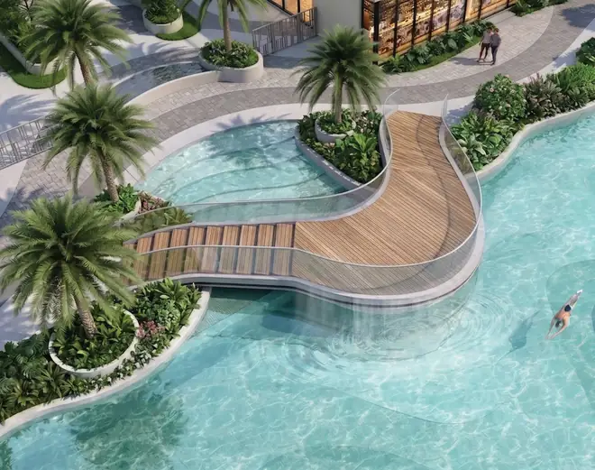 Cầu bộ hành với hiệu ứng phun sương uốn cong trên hồ bơi Gladia Heights nhìn từ trên cao