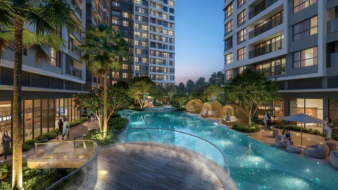Hồ bơi ánh sao Gladia Heights buổi tối với chòi tắm nắng và tháp căn hộ
