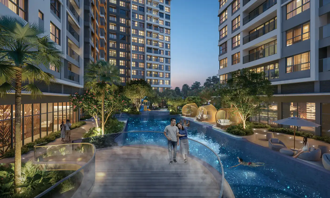 Gladia Heights về đêm: cầu bộ hành cạnh hồ bơi và các tháp căn hộ lên đèn