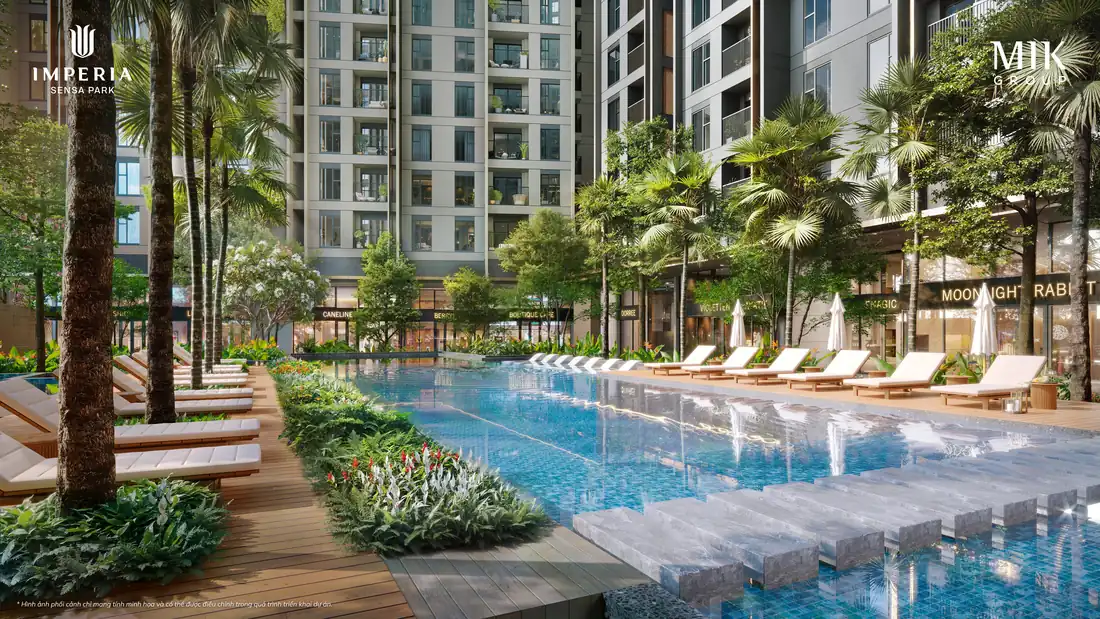 Hồ bơi Aura Flow giữa hàng cọ và ghế tắm nắng dưới chân tháp căn hộ Imperia Sensa Park