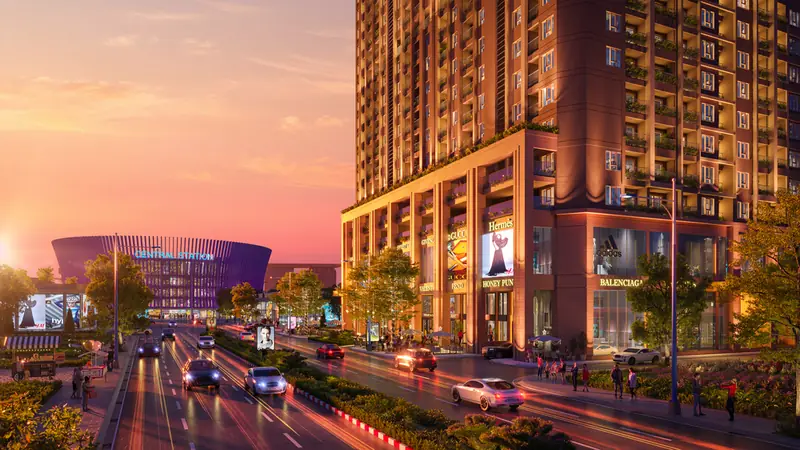 Mặt tiền khối đế thương mại Nam Mekong Grand Plaza về đêm, phía xa là nhà ga metro trung tâm WTC