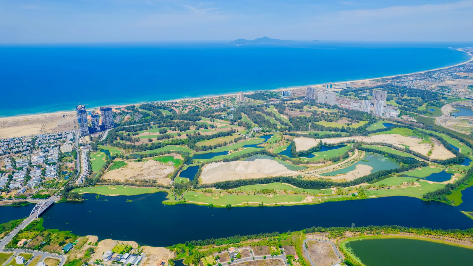 Flycam sân golf 36 hố Legend Danang Golf Resort, sông Cổ Cò và biển Ngũ Hành Sơn quanh Newtown Legend (ảnh thực tế)