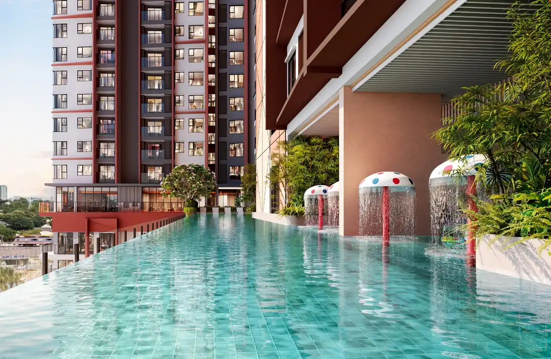 Hồ bơi tràn bờ tầng 6 SkySOLIS giữa mảng xanh và các tháp căn hộ