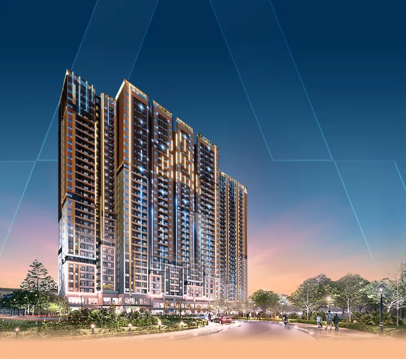 Phối cảnh 2 tháp The Aspira về đêm: mặt đứng sáng đèn, khối đế thương mại và lối vào rợp cây