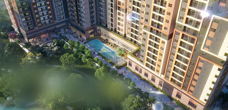 Hồ bơi Flamenco Pool giữa 2 tháp The Aspira về đêm, bao quanh là mảng xanh nội khu