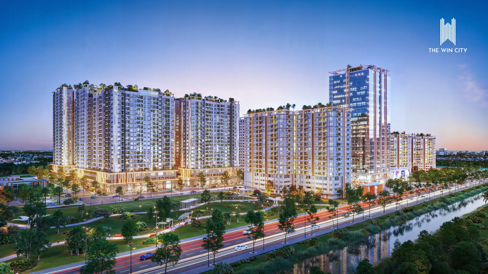 Các tòa căn hộ The Win City sáng đèn lúc chạng vạng bên kênh nước (ảnh minh họa)